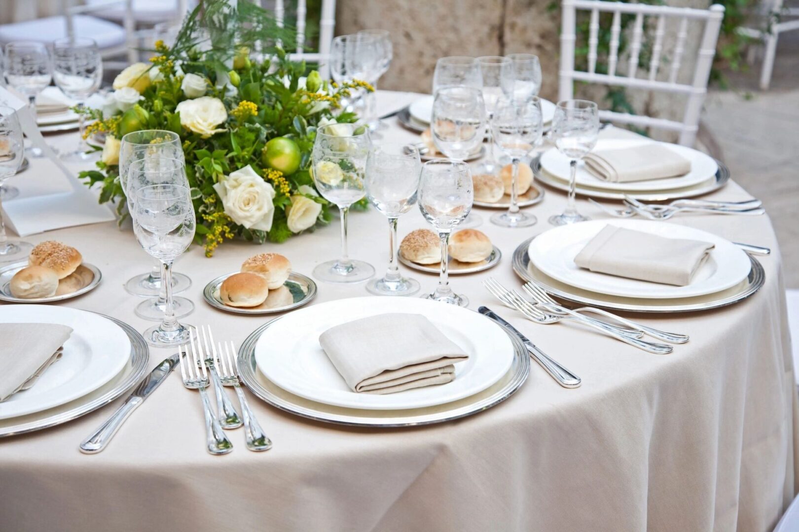 A table set with plates and silverware on top of it.