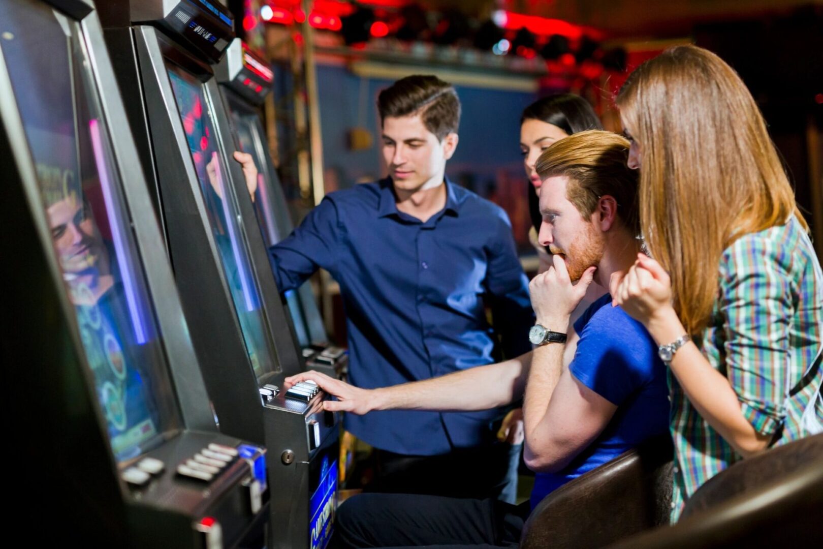 A group of people playing video games on the nintendo wii.