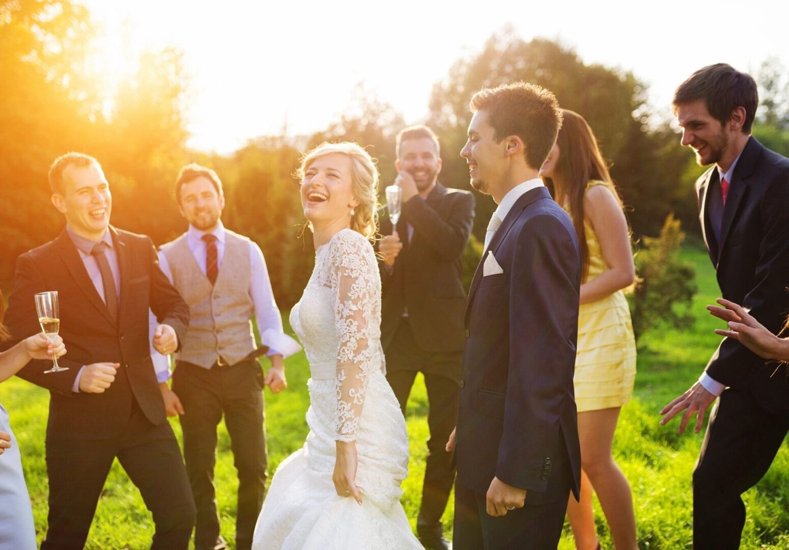 A group of people standing around each other.